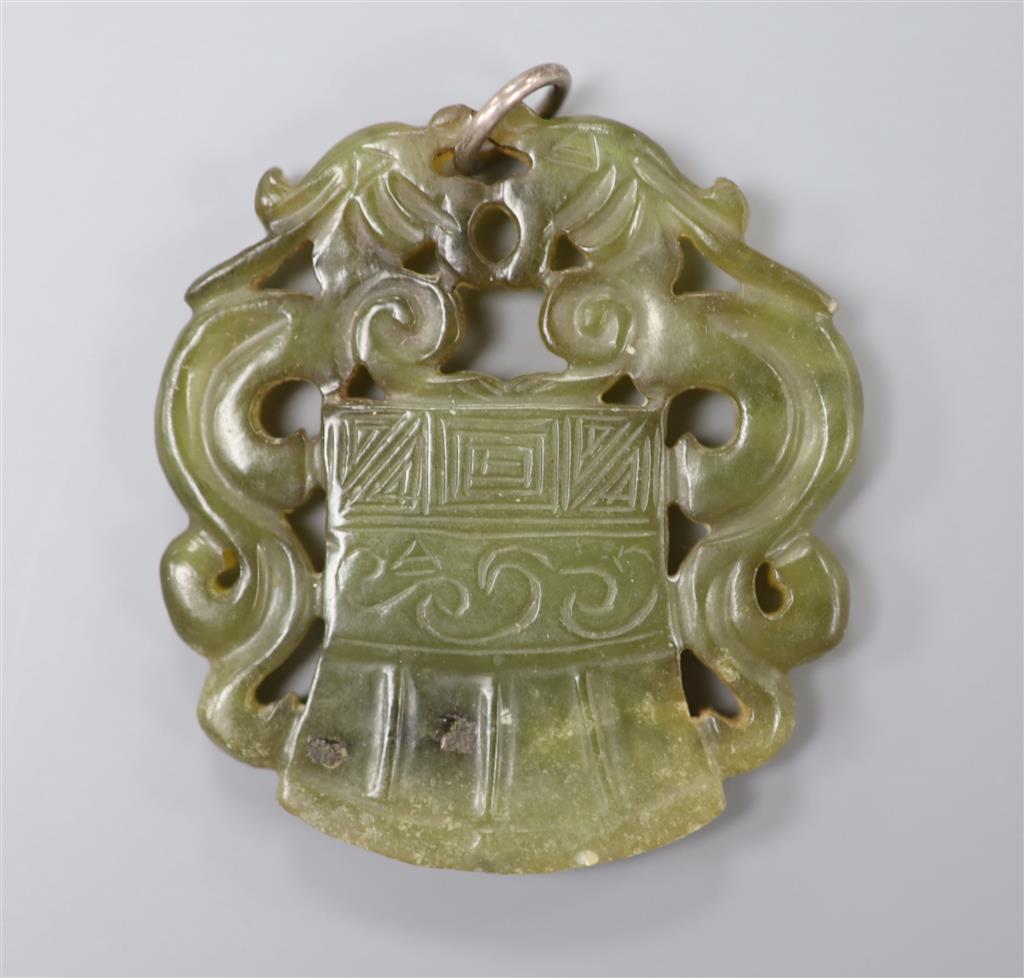 A Chinese carved bowenite pendant, 54mm.